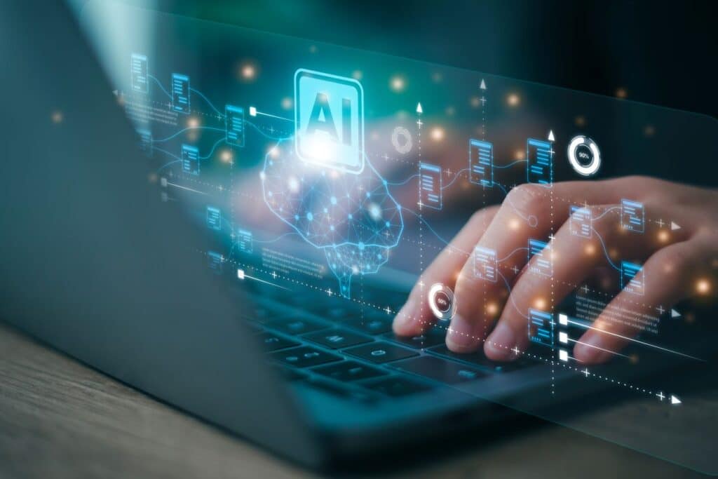 Hands typing on laptop with AI and data visualization overlay, illustrating AI integration in hydrogen sensor data analysis.