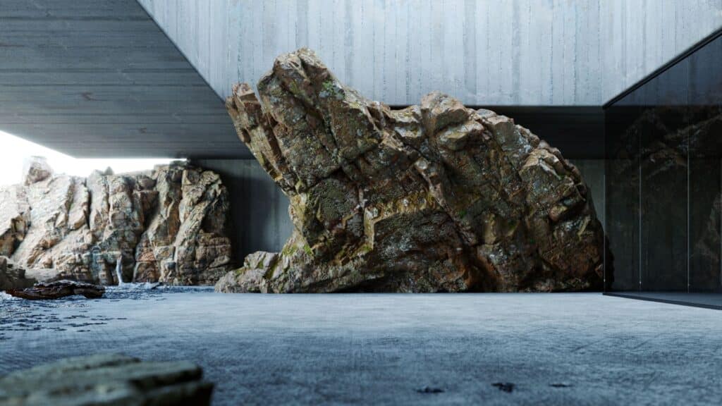 Felsen unter Betondach neben Glasfassade